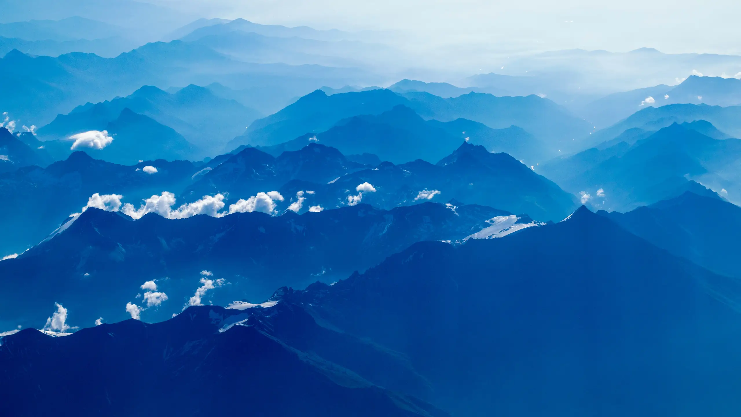 mountain range under clear blue sky