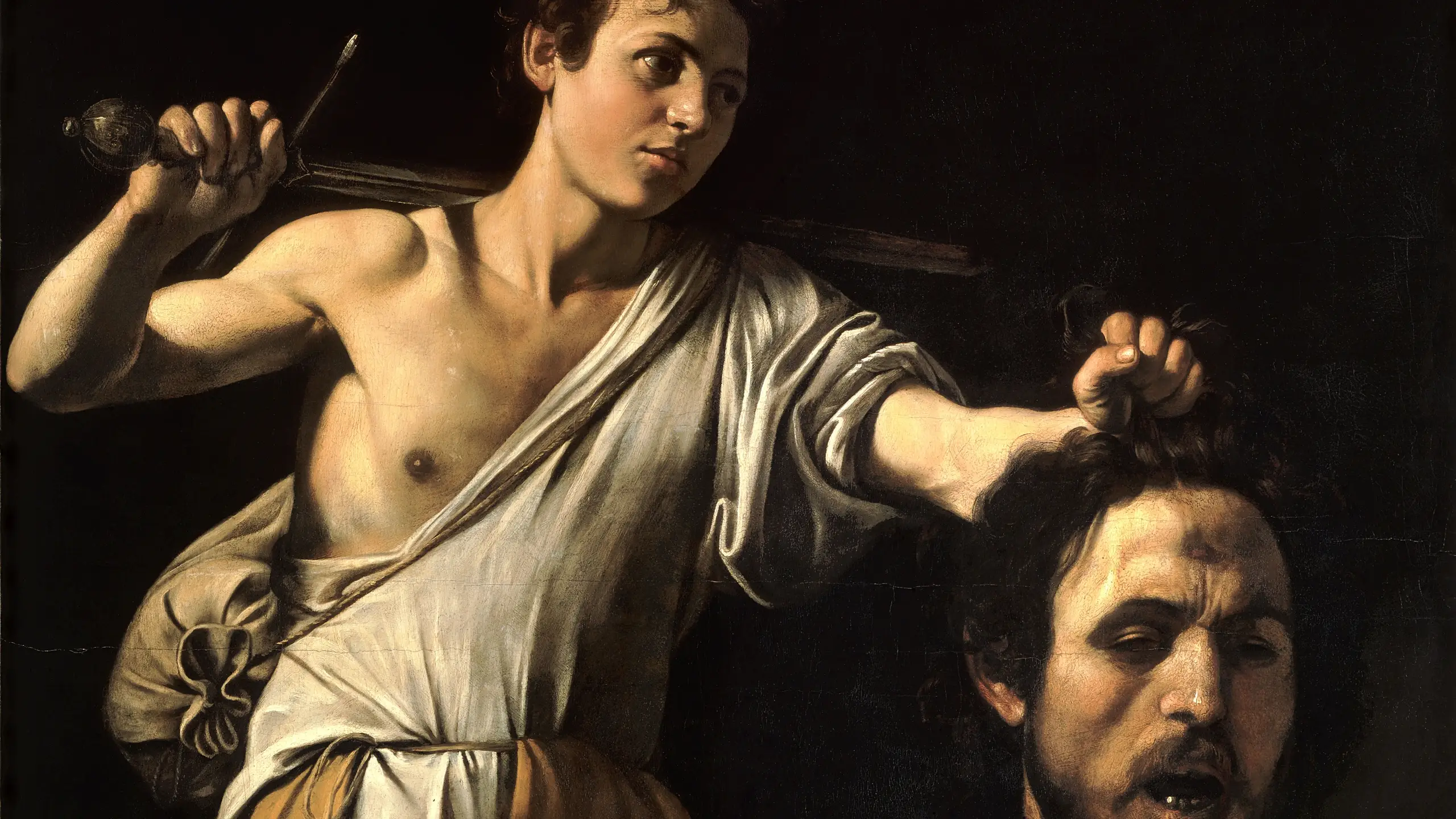 A painting of David with the head of Goliath by Caravaggio